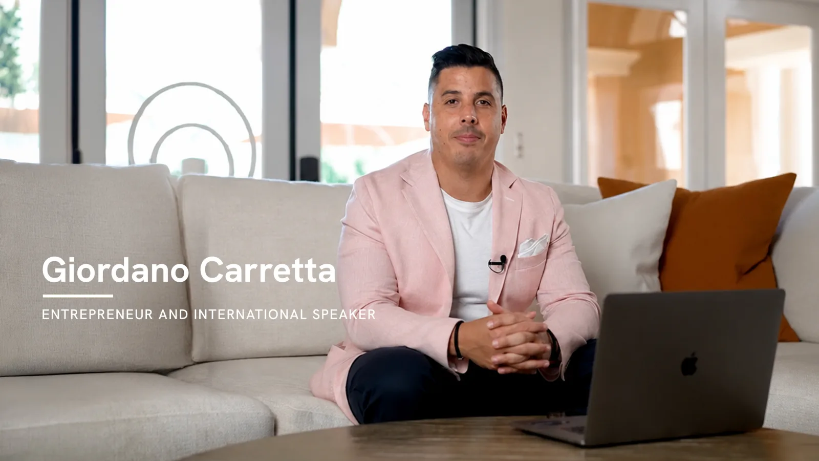 Giordano Carretta, entrepreneur and international speaker, seated to introduce the compensation plan